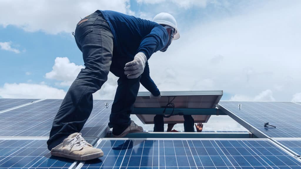 Solar Panel Replacement in Colorado Springs Feature Image: Solar panel technicians removing and replacing a solar panel